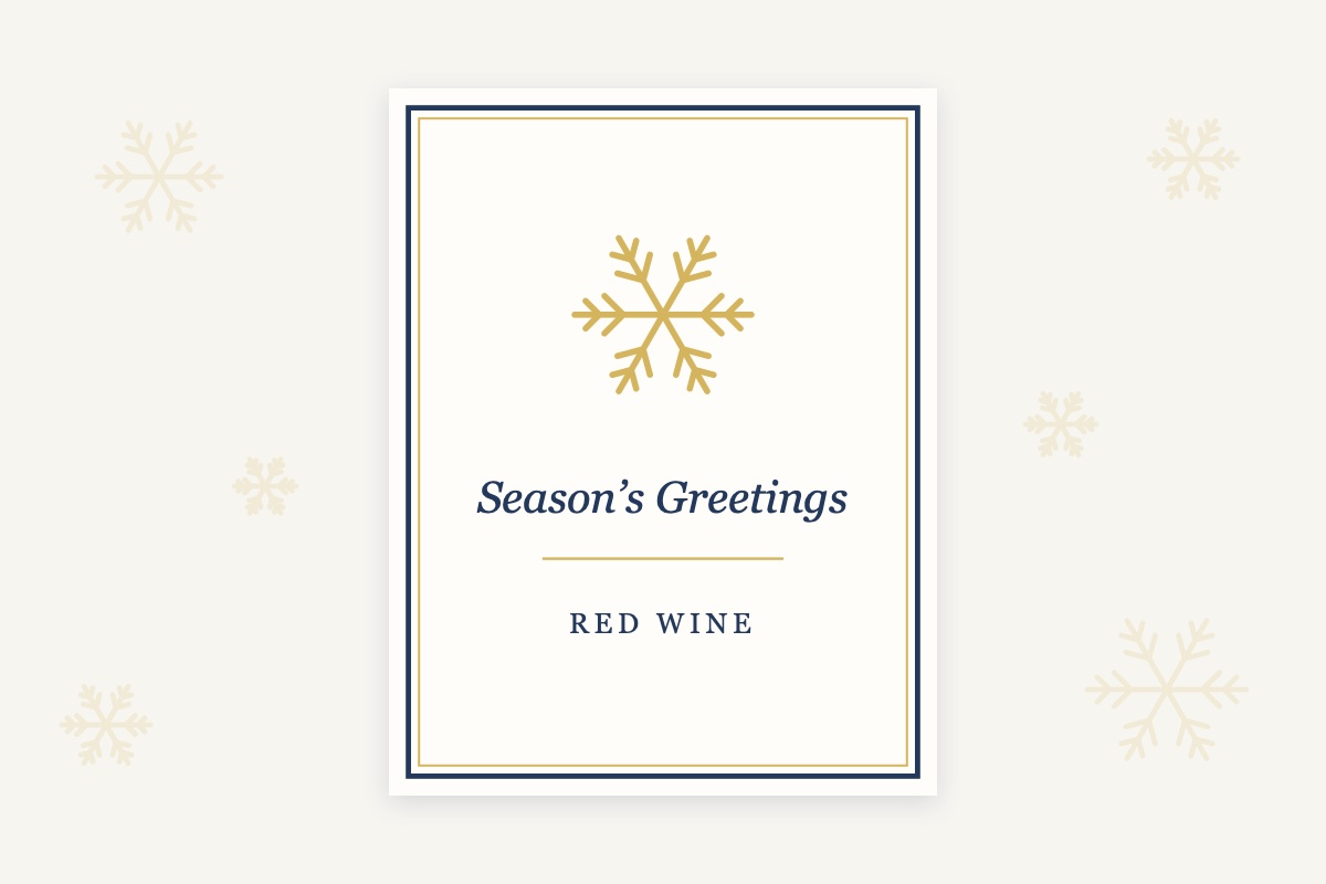 An approved wine label with a gold snowflake and a Season's Greetings salutation added
